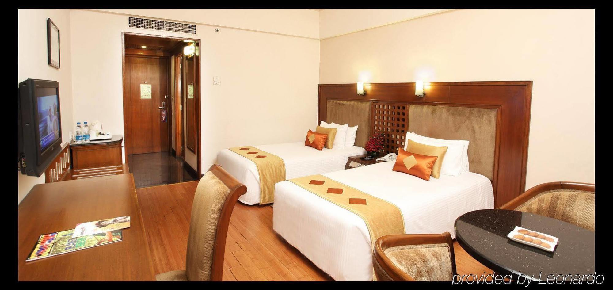 Greenpark Ченай Стая снимка A room at the hotel
