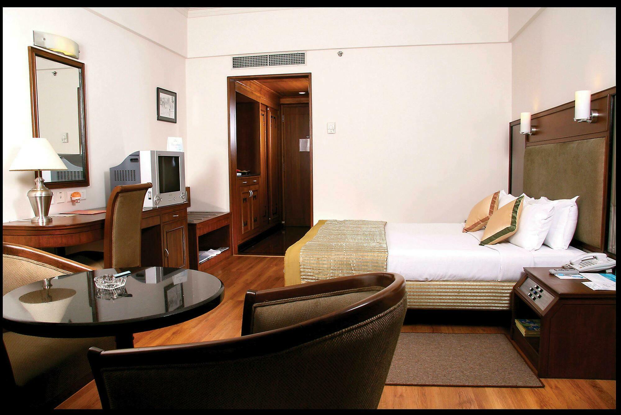 Greenpark Ченай Стая снимка A room at the hotel